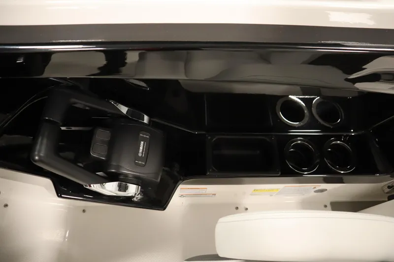 Slide: The Image of 2026 Yamaha Boats AR250 dashboard with steering wheel and cup holders. - 22