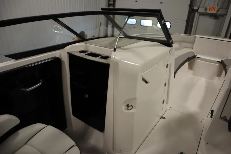 Slide: The Image of 2026 Yamaha Boats AR250 interior with sleek seating and modern dashboard design. - 25