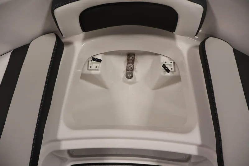 Slide: The Image of Interior seating area of 2026 Yamaha Boats AR195, featuring sleek white and black design. - 17