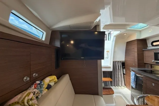 Slide: The Image of Interior of 2020 Boston Whaler 325 Conquest, featuring modern amenities and cozy seating area. - 19