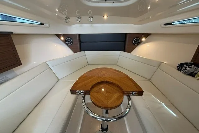 Slide: The Image of Luxurious interior of 2020 Boston Whaler 325 Conquest with elegant seating and wooden table. - 20