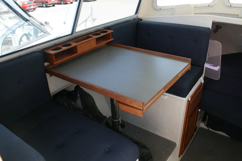 Slide: The Image of Interior of 2007 Sea Sport 2200 Sportsman boat with table and seating area. - 5