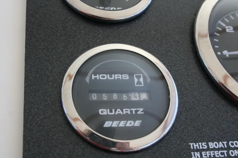 Slide: The Image of Hour meter on 2007 Sea Sport 2200 Sportsman boat dashboard, displaying 586.4 hours. - 4