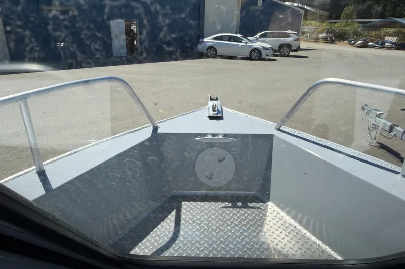 Slide: The Image of The image shows the bow of a Hewescraft 180 ProV Hard Top boat with a metal floor. - 8