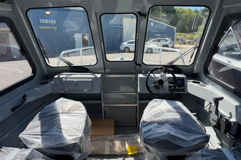 Slide: The Image of Interior of a Hewescraft 180 ProV Hard Top with two seats and a helm station. - 6