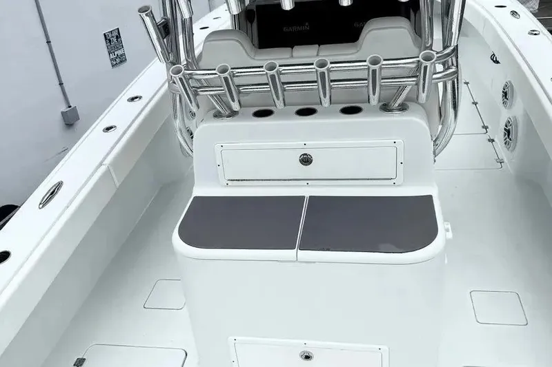 Slide: The Image of 2022 Freeman 34VH boat interior with rod holders and storage compartments. - 10