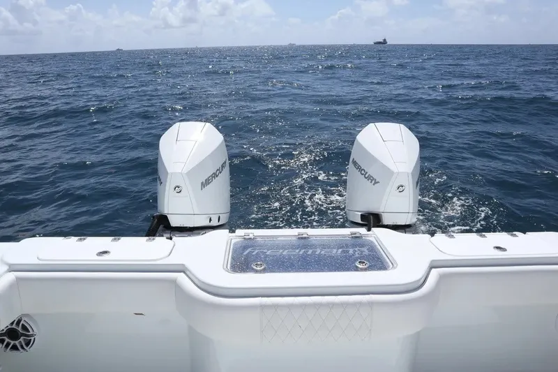 Slide: The Image of Freeman 34VH 2022 boat with dual Mercury engines on open sea. - 19