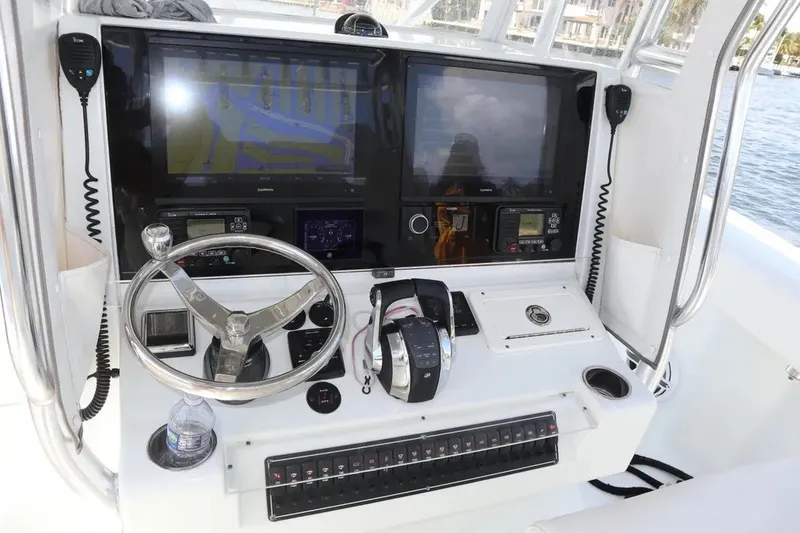 Slide: The Image of Helm of 2022 Freeman 34VH boat with navigation screens and controls. - 49
