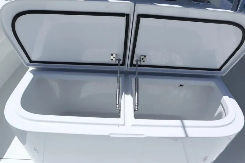 Slide: The Image of Open storage compartment on a 2022 Freeman 34VH boat, showcasing interior space. - 26