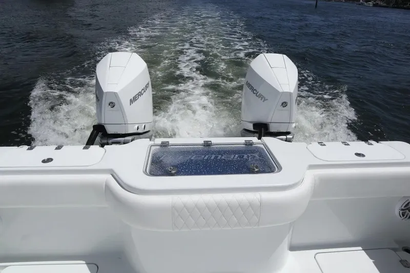 Slide: The Image of Freeman 34VH 2022 boat with dual Mercury outboard engines on water. - 46