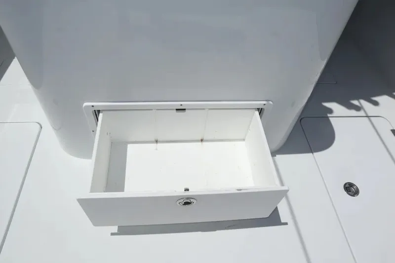 Slide: The Image of Open storage compartment on a 2022 Freeman 34VH boat deck. - 45