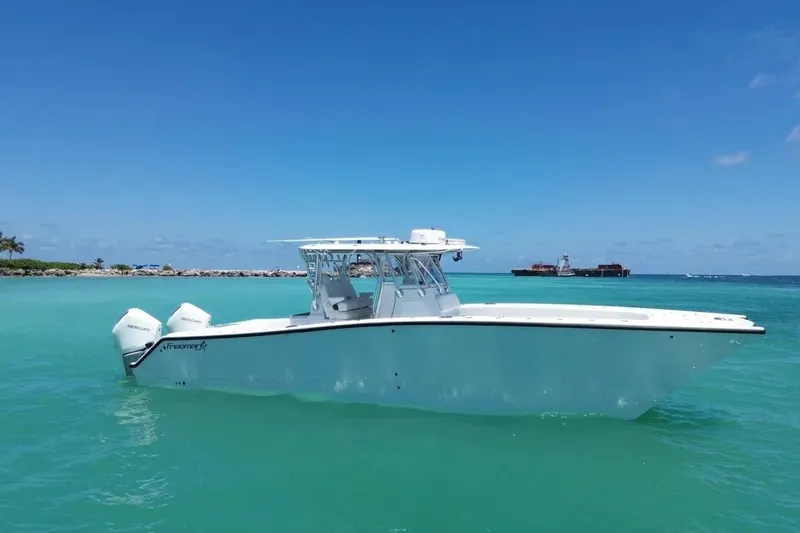 The Image of 2022 Freeman 34VH boat on turquoise water under clear blue sky. - 1