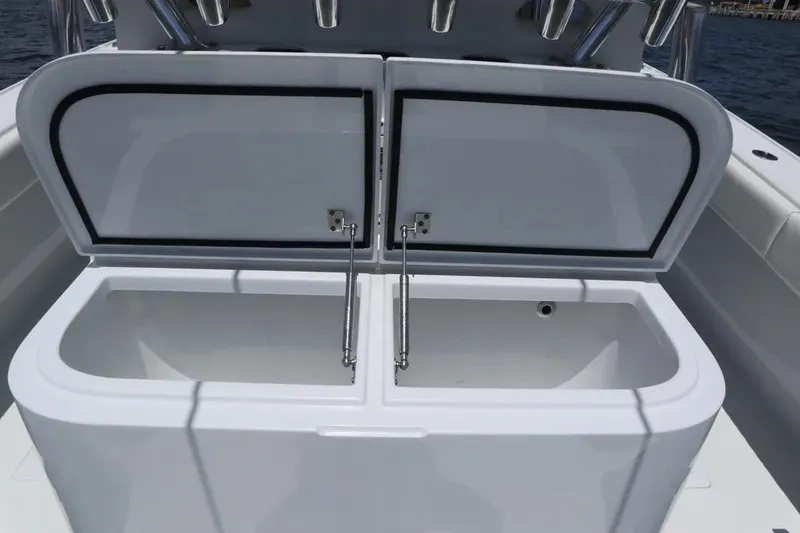 Slide: The Image of Open storage compartments on a 2022 Freeman 34VH boat, showcasing interior space. - 29