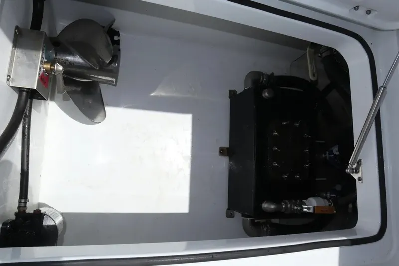 Slide: The Image of Engine compartment of a 2022 Freeman 34VH boat, showcasing mechanical components. - 32