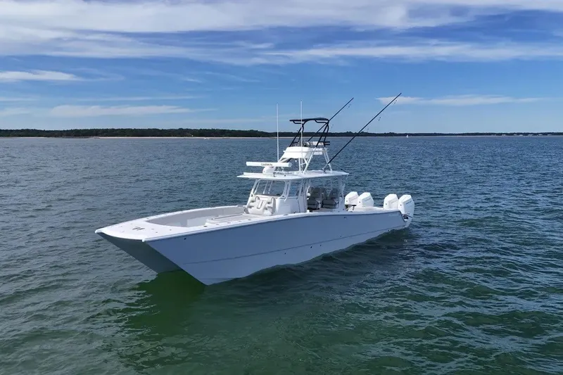 The Image of Freeman 42LR 2025 boat on open water under clear blue sky. - 1