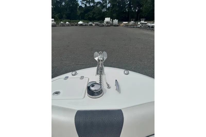 Slide: The Image of Bow view of 2021 Wellcraft 262 Fisherman boat in a parking area. - 20