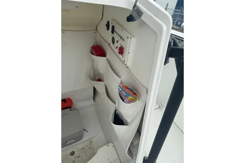 Slide: The Image of Interior storage of 2021 Wellcraft 262 Fisherman boat with organized compartments. - 15