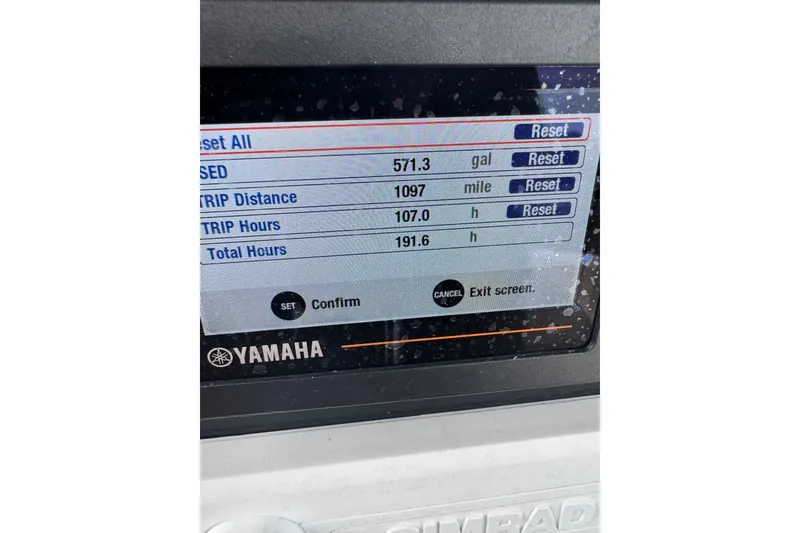 Slide: The Image of Display screen showing fuel usage and trip data on a 2021 Wellcraft 262 Fisherman boat. - 17