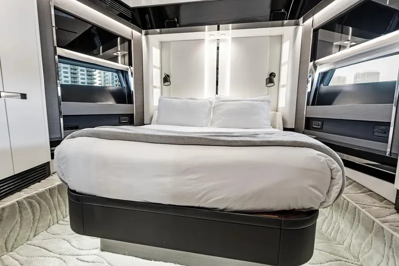 Slide: The Image of Luxurious bedroom interior of 2024 Azimut S8 yacht, featuring modern design and plush bedding. - 32