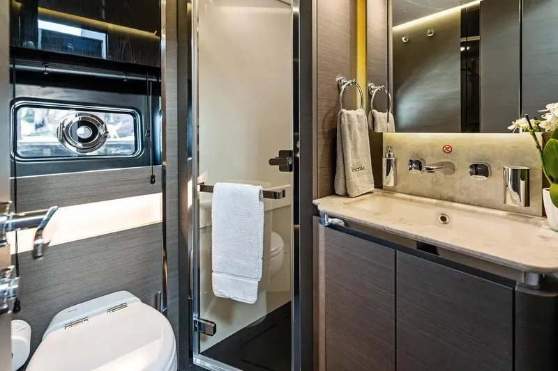 Slide: The Image of Luxurious bathroom interior of 2024 Azimut S8 yacht, featuring modern fixtures and elegant design. - 27
