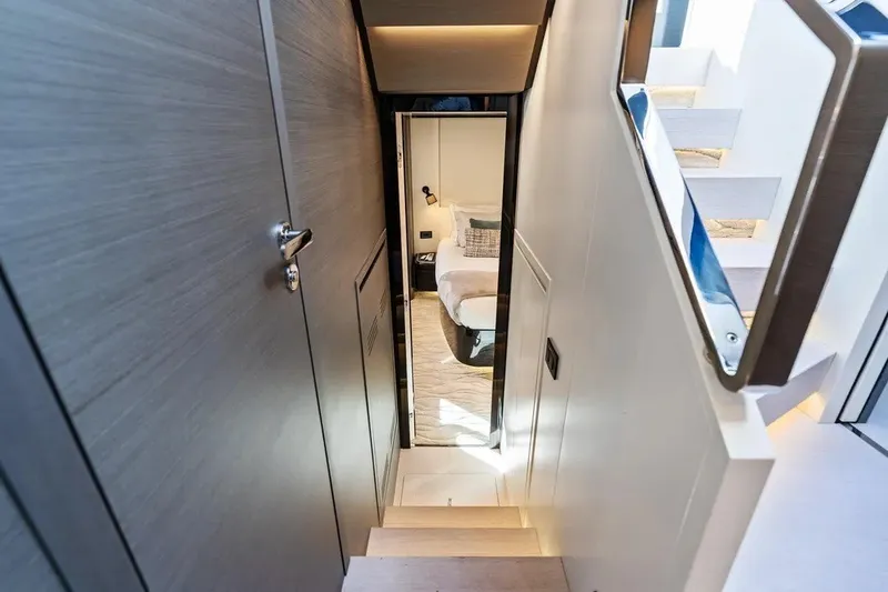Slide: The Image of Luxurious interior of 2024 Azimut S8 yacht, featuring modern staircase and elegant cabin entrance. - 21
