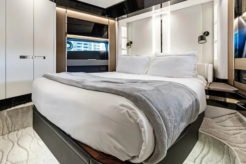 Slide: The Image of Luxurious bedroom interior of 2024 Azimut S8 yacht with modern design and cozy bedding. - 33