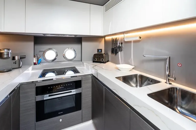 Slide: The Image of Modern kitchen in 2024 Azimut S8 yacht with sleek appliances and dual sinks. - 38