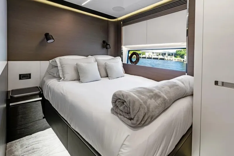 Slide: The Image of Luxurious bedroom interior of 2024 Azimut S8 yacht with elegant bedding and waterfront view. - 28