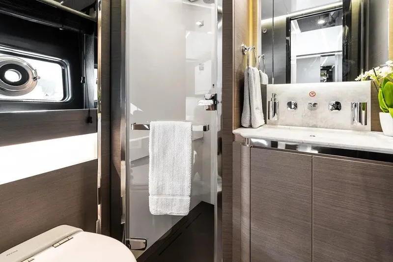 Slide: The Image of Luxurious bathroom interior of 2024 Azimut S8 yacht, featuring modern fixtures and elegant design. - 25