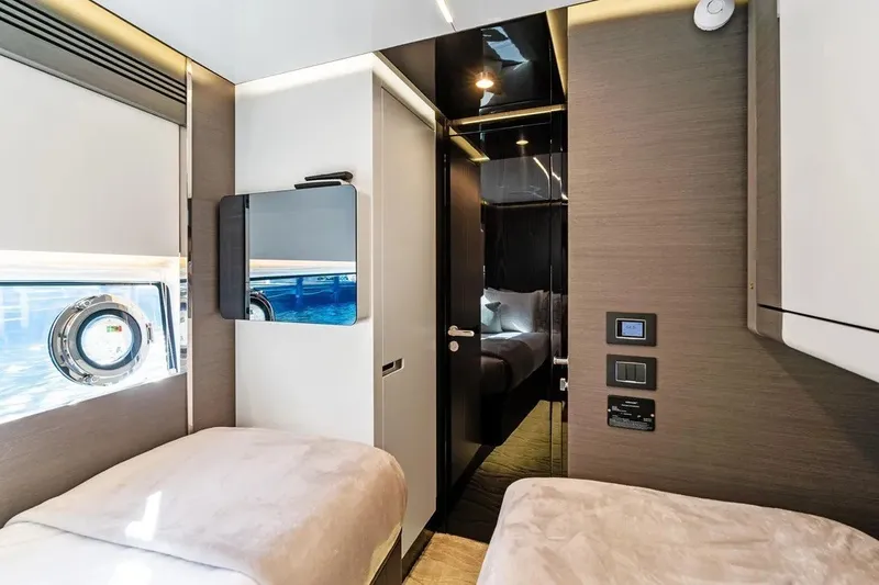Slide: The Image of Luxurious interior of 2024 Azimut S8 yacht cabin with modern design and twin beds. - 24