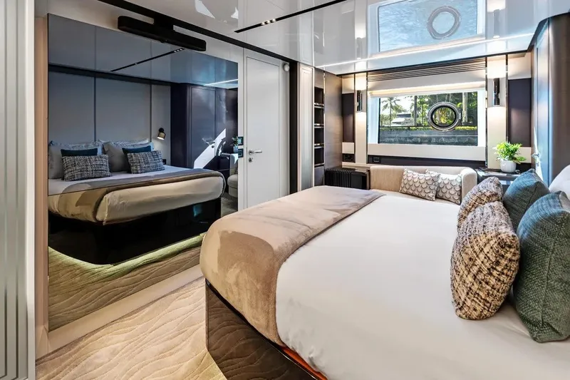 Slide: The Image of Luxurious 2024 Azimut S8 yacht bedroom with modern decor and large window view. - 15
