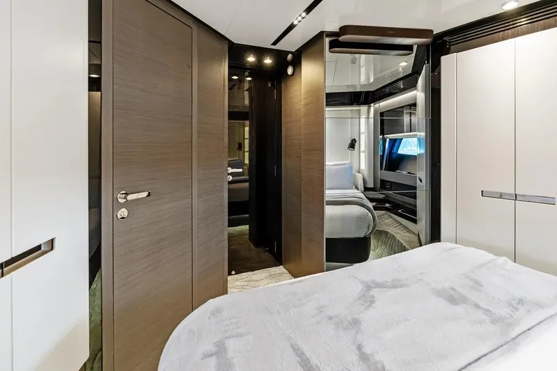 Slide: The Image of Luxurious interior of 2024 Azimut S8 yacht bedroom with modern design and elegant furnishings. - 34