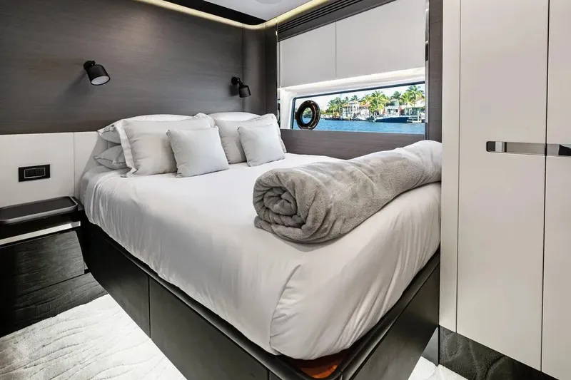Slide: The Image of Luxurious bedroom interior of 2024 Azimut S8 yacht with modern design and waterfront view. - 31