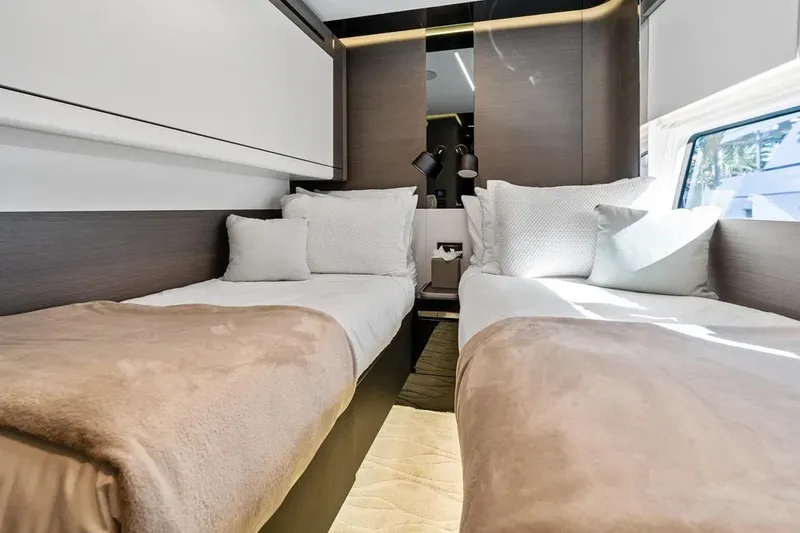 Slide: The Image of Luxurious twin cabin interior of 2024 Azimut S8 yacht with modern design and cozy bedding. - 26