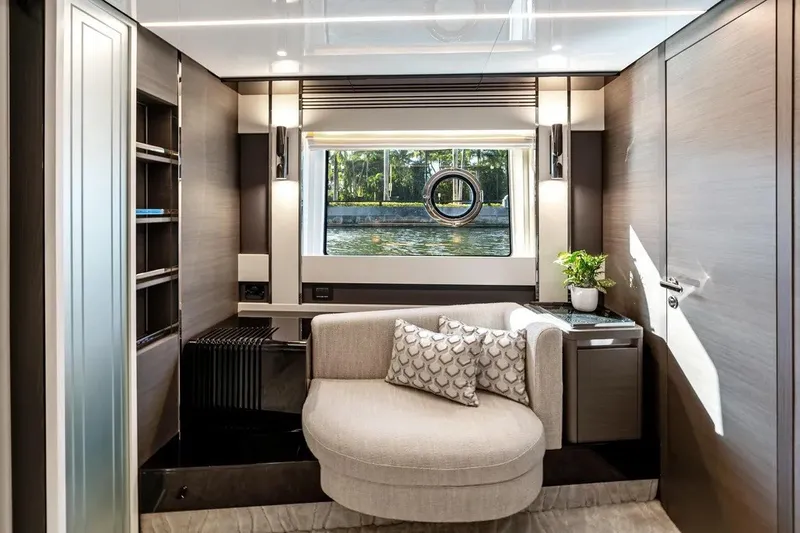 Slide: The Image of Luxurious interior of 2024 Azimut S8 yacht with elegant seating and window view. - 16