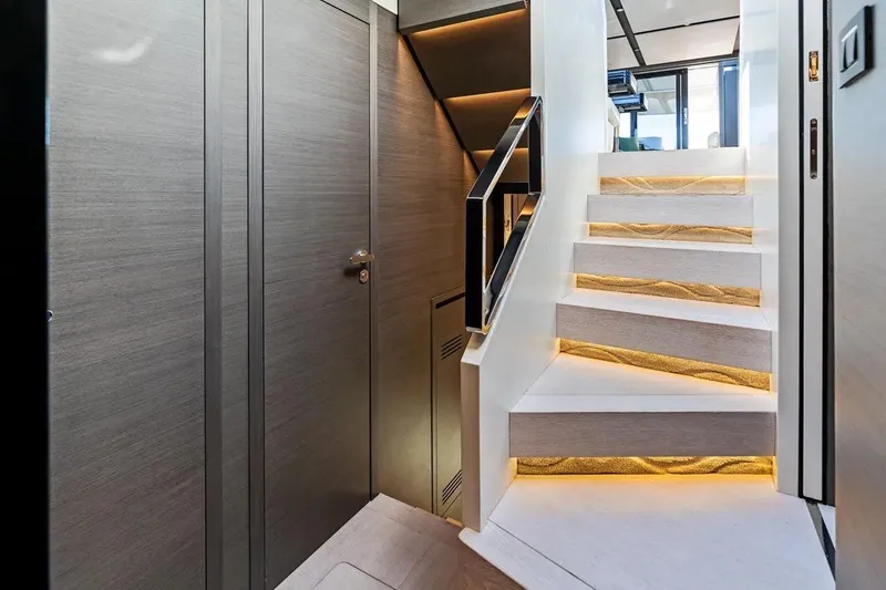 Slide: The Image of Luxurious interior staircase of 2024 Azimut S8 yacht with modern lighting. - 22