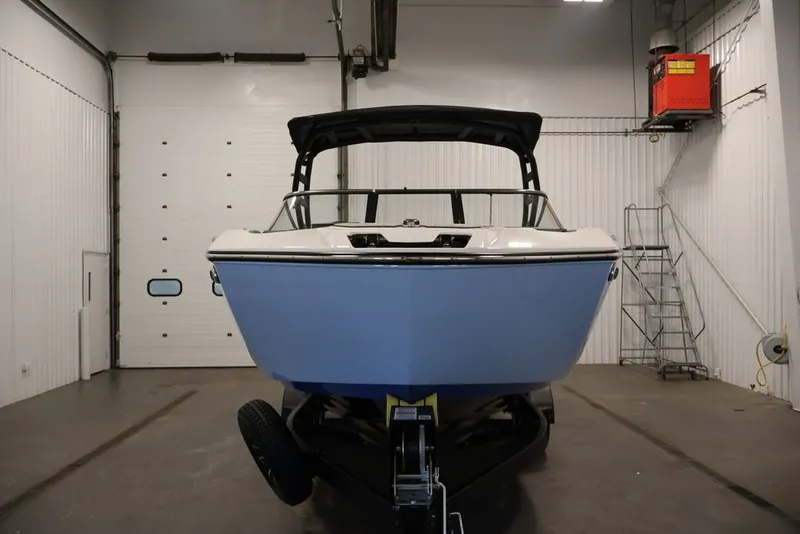 Slide: The Image of 2026 Yamaha Boats 252SD in a garage, showcasing sleek design and modern features. - 42