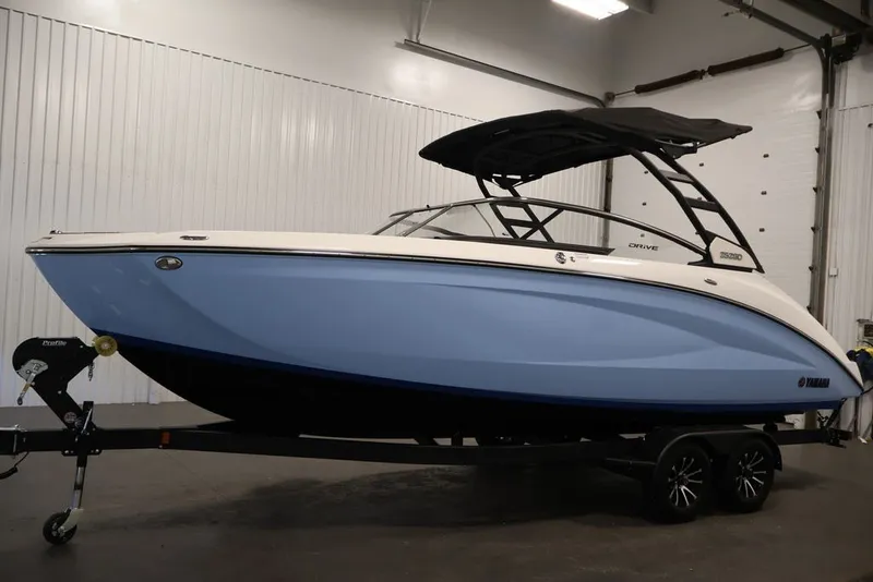Slide: The Image of 2026 Yamaha Boats 252SD in a showroom, featuring sleek design and modern aesthetics. - 15
