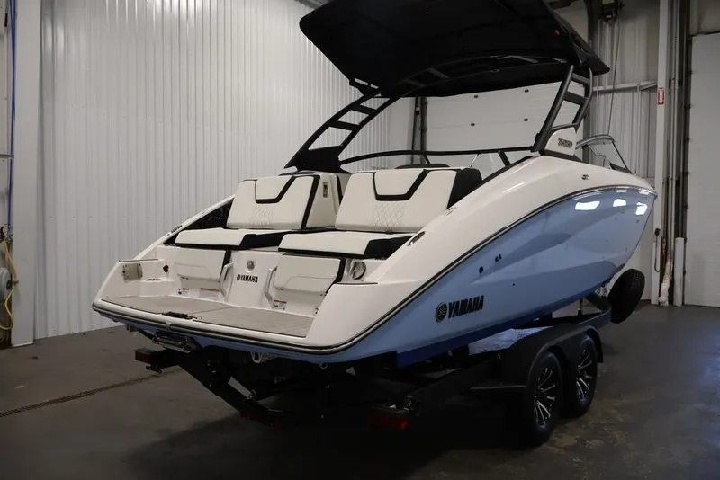 Slide: The Image of 2026 Yamaha Boats 252SD in a garage, showcasing sleek design and modern features. - 44
