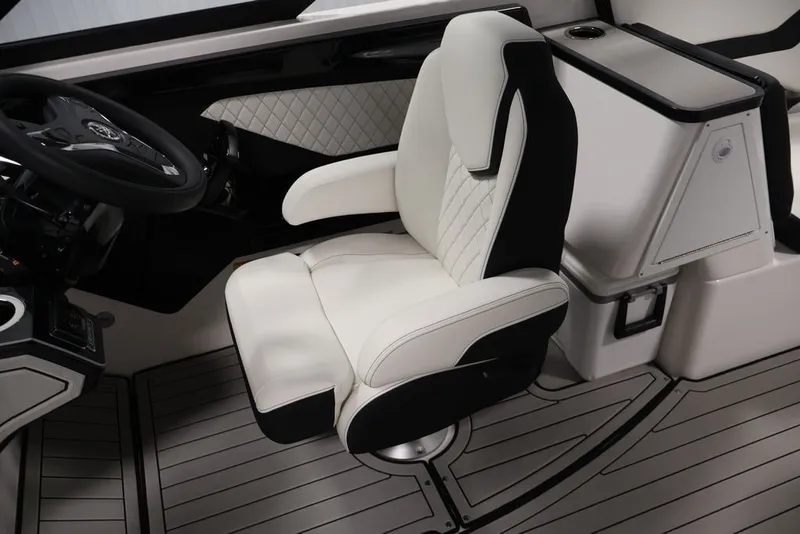 Slide: The Image of Luxury captain's seat in 2026 Yamaha Boats 252SD, featuring sleek design and premium materials. - 46