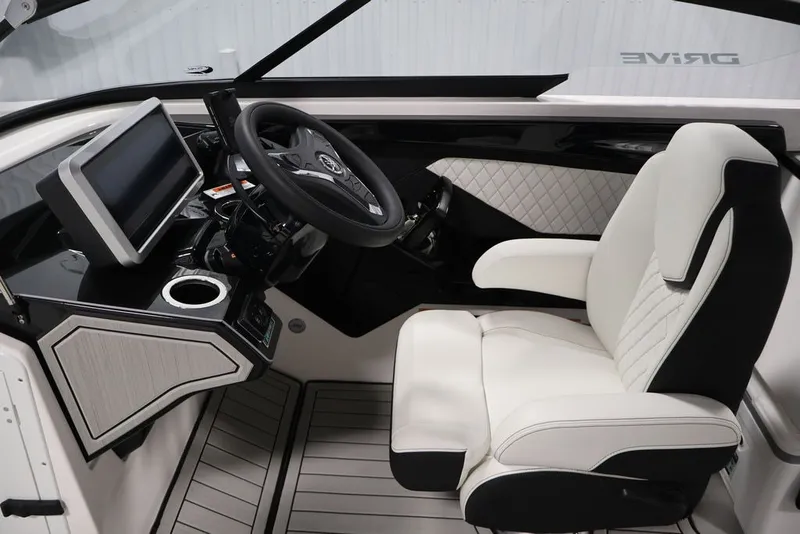 Slide: The Image of Interior of 2026 Yamaha Boats 252SD, featuring modern helm and luxurious seating. - 21