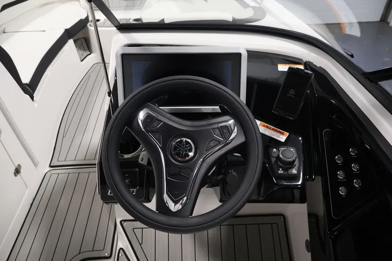 Slide: The Image of 2026 Yamaha Boats 252SD helm with modern steering wheel and control panel. - 20