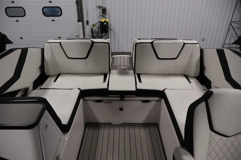 Slide: The Image of 2026 Yamaha Boats 252SD interior with luxurious white and black seating. - 36