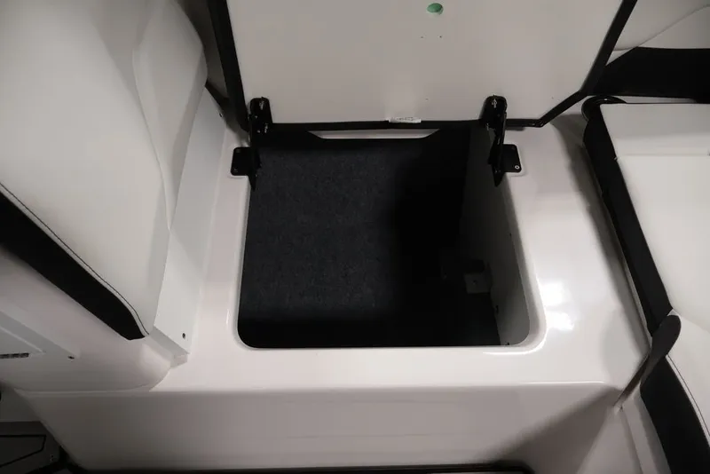 Slide: The Image of Open storage compartment on 2026 Yamaha Boats 252SD, showcasing spacious interior design. - 34
