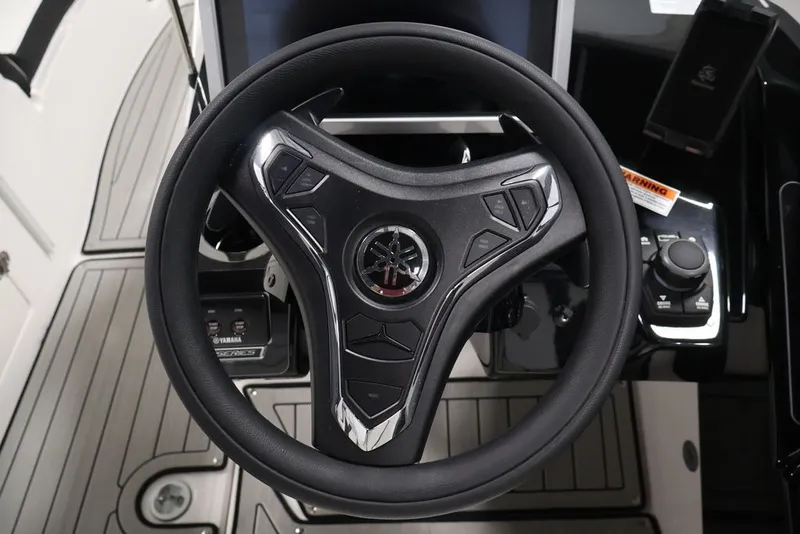 Slide: The Image of Steering wheel of 2026 Yamaha Boats 252SD, featuring modern controls and sleek design. - 14