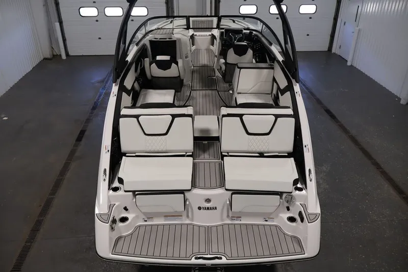 Slide: The Image of 2026 Yamaha Boats 252SD interior, showcasing sleek seating and modern design in a spacious layout. - 22