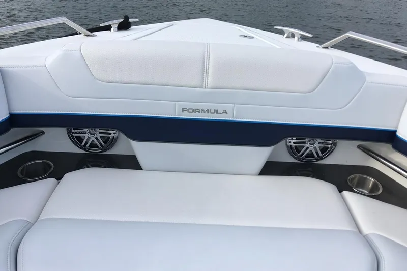 Slide: The Image of Manufacturer Provided Image: 2022 Formula 380 Super Sport Crossover OB boat interior with white seating and speakers. - 18