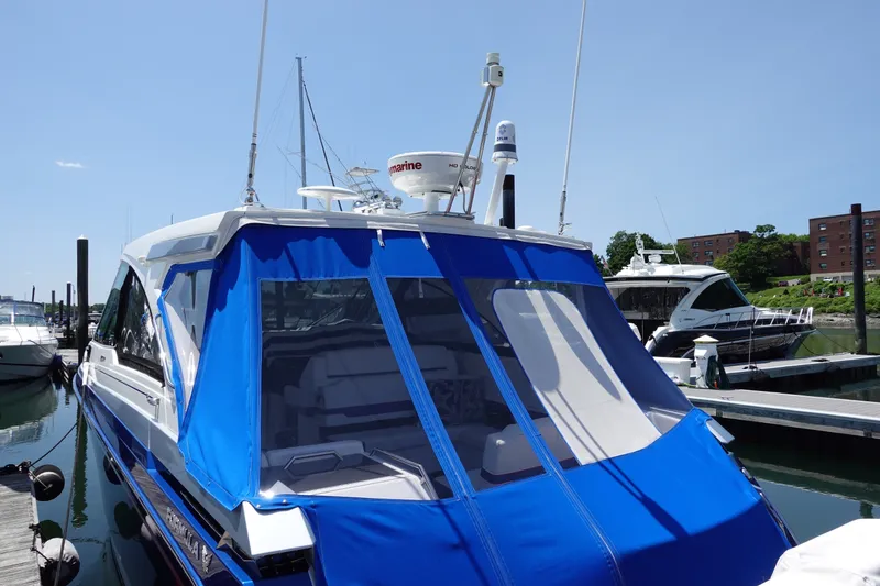 Slide: The Image of 2022 Formula 380 Super Sport Crossover OB docked with blue canopy. - 3