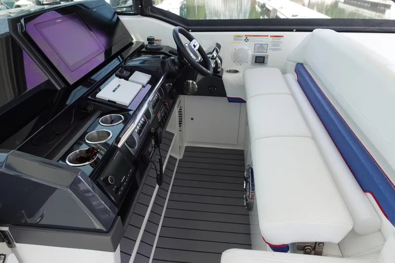 Slide: The Image of 2022 Formula 380 Super Sport Crossover OB cockpit with modern controls and seating. - 8