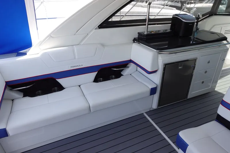 Slide: The Image of 2022 Formula 380 Super Sport Crossover OB interior with sleek seating and modern amenities. - 12
